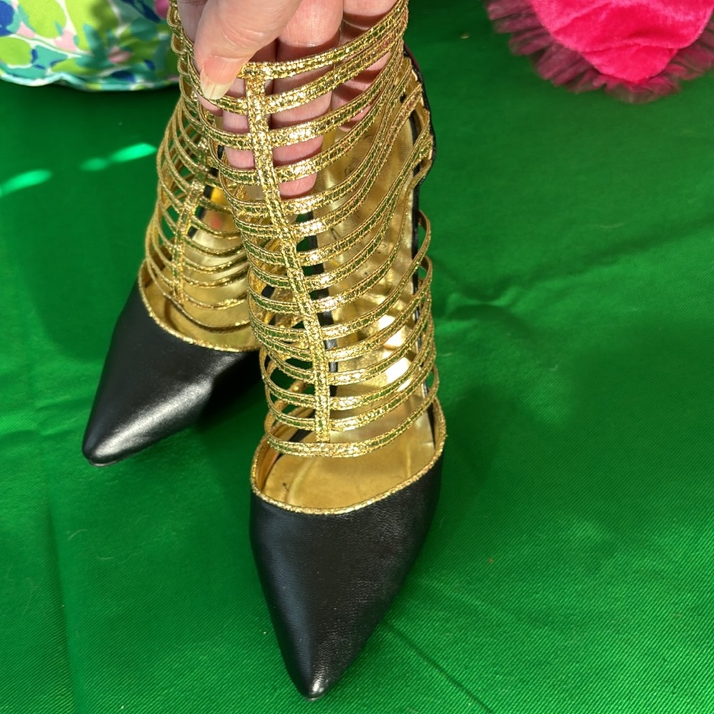 Privileged black stiletto heels and gold caged look booties